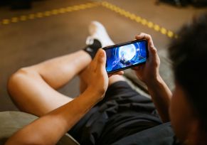person playing mobile game