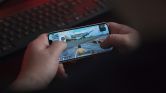 Person Playing on Smartphone