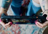 Person Holding Steam Deck OLED