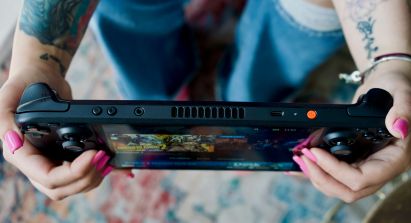 Person Holding Steam Deck OLED