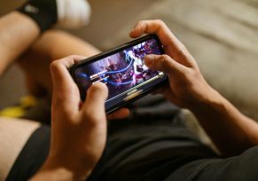 Person Playing a Mobile Video Game